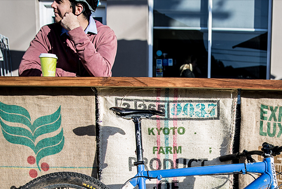 Cyclist grabbing a coffee.
